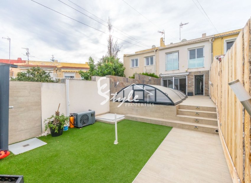 Buy townhouse with garden and pool in Torrevieja. ID 6250