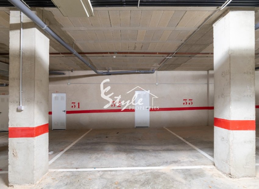 For sale top floor apartment with private solarium and parking in La Ciñuelica, Punta Prima, Costa Blanca. ID1965