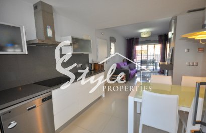 Apartments with private garden in a closed urbanization by the sea in Punta Prima, Orihuela Costa, Costa Blanca, Spain